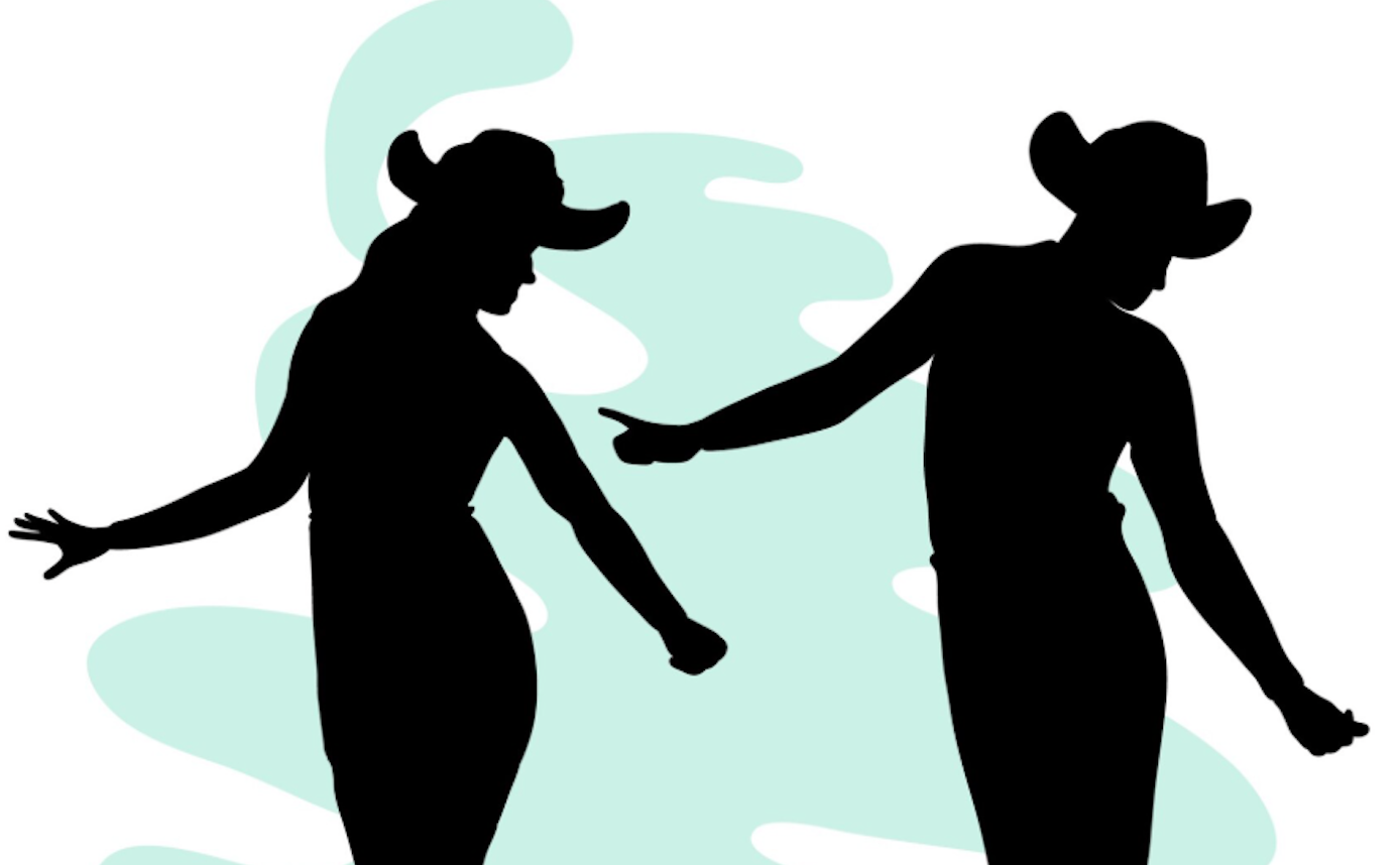 Silhouetten eines tanzenden Paares mit Cowboyhüten.
