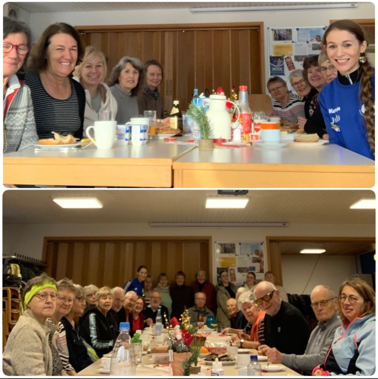 Gemeinsames Frühstück in einem Gruppenraum mit gedecktem Tisch und mehreren Personen