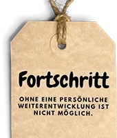 Schild mit dem Schriftzug Fortschritt und dem Spruch Ohne eine persönliche Weiterentwicklung ist nicht möglich.