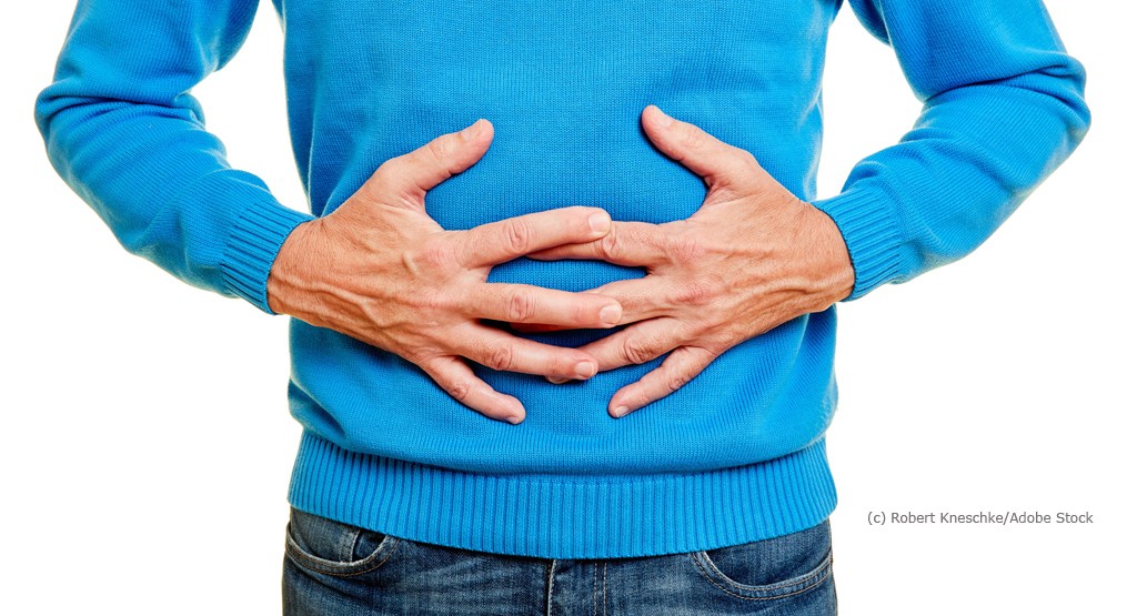Prostata Hilfe Deutschland: Mann mit Händen auf dem Bauch