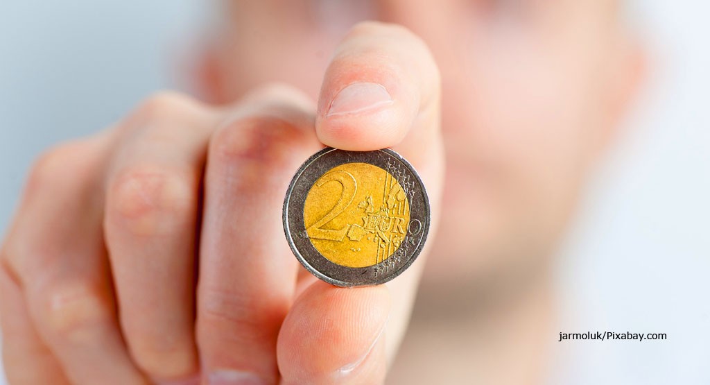 Prostata Hilfe Deutschland: Illustrationsbild - Mann mit 2-Euro Stück