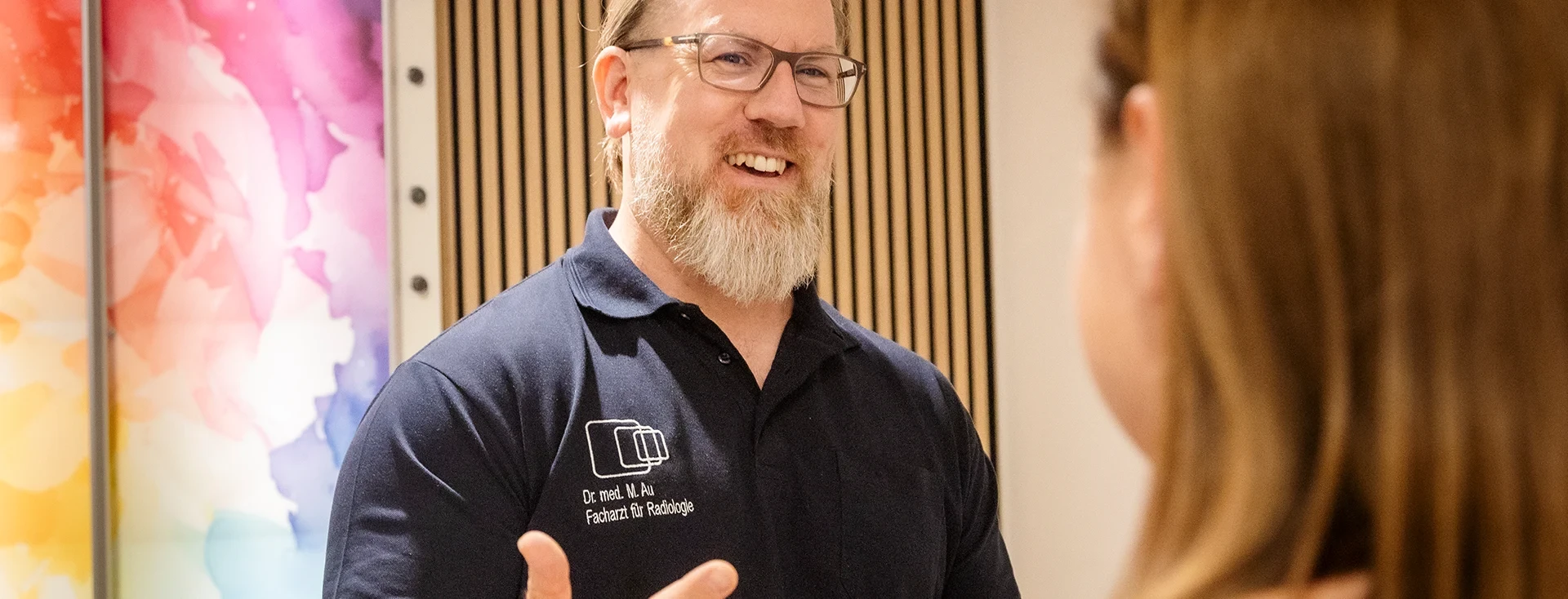 Dr. med. M. Au, Facharzt für Radiologie, bei einer Veranstaltung