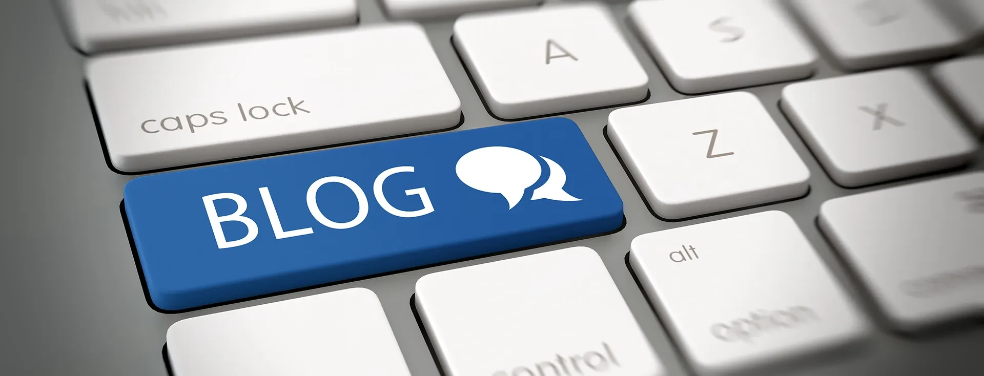 Blog-Header auf Computertastatur mit Sprechblasen-Symbol