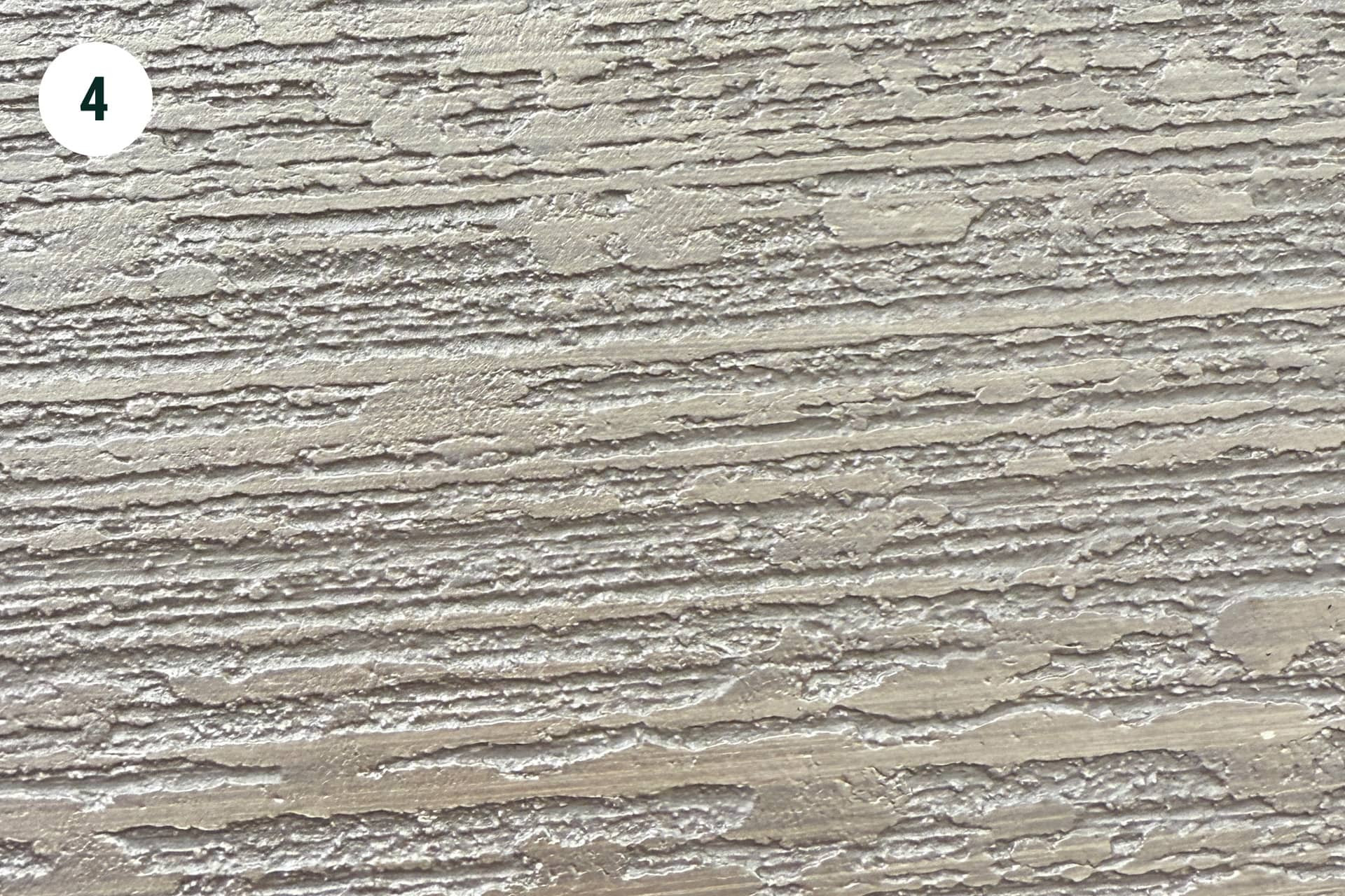 pb-stucco Materialien – Strukturierte Putzoberfläche in Nahaufnahme Strukturierte Oberfläche von pb-stucco Materialien, Detailansicht Putzstruktur