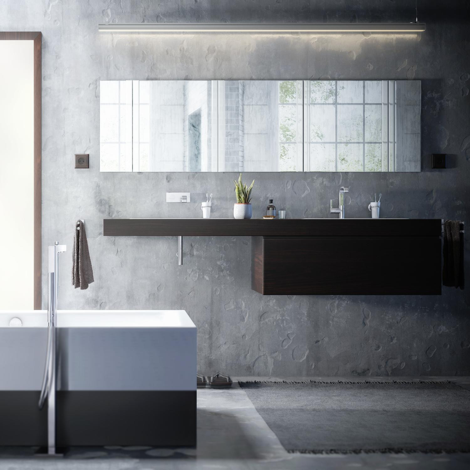 Modernes Badezimmer im Industrial Style mit Betonwand, freistehender Badewanne und dunklem Waschtisch