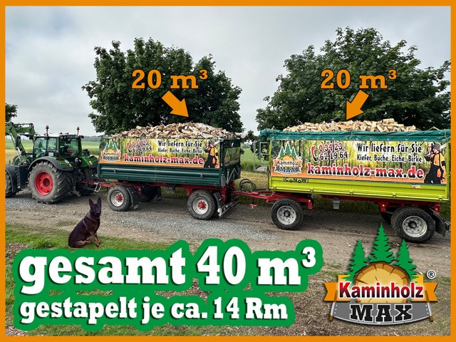 Zwei Humbaur Anhänger mit jeweils 20 m³ Kaminholz von kaminholz-max.de auf einem Feldweg, Gesamtmenge 40 m³, Werbung für Kaminholzlieferung.