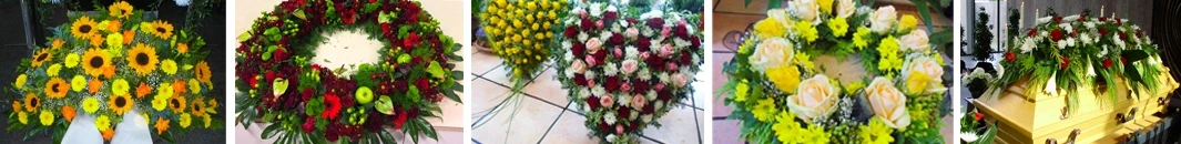 Trauerfloristik mit Herz aus roten und weißen Rosen sowie gelbem Blumengesteck