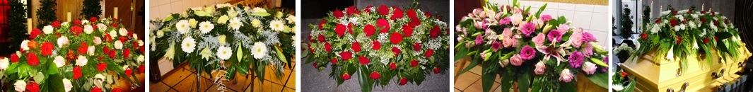Sargschmuck mit roten Rosen und weißen Blumen als Trauerfloristik