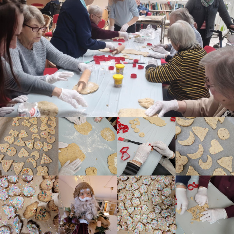 Senioren backen gemeinsam Weihnachtsplätzchen und verzieren Kekse in einer Gruppe.