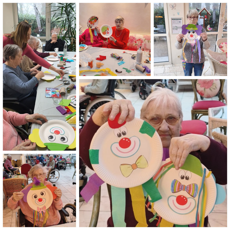 Senioren basteln bunte Clown-Gesichter aus Papptellern in einer kreativen Gruppenaktivität