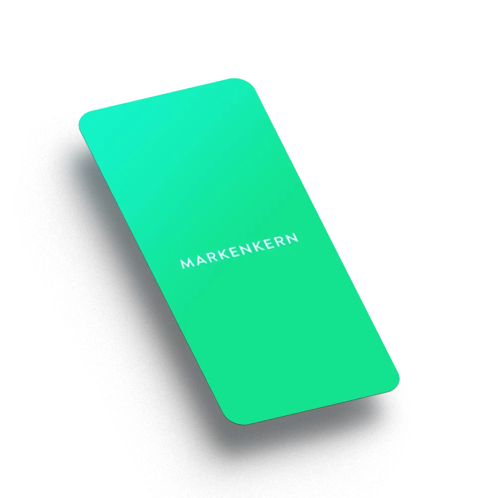 Grünes Smartphone mit dem Wort 'Markenkern' auf dem Bildschirm