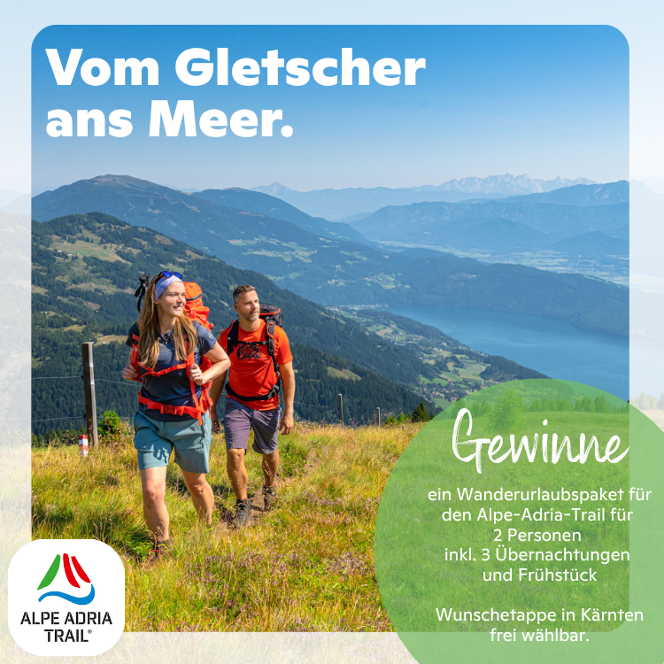 Wanderer im Karwendel auf dem Alpe-Adria-Trail mit Blick auf Kärntner Berge und See, Gewinnspiel für Wanderurlaubspaket.